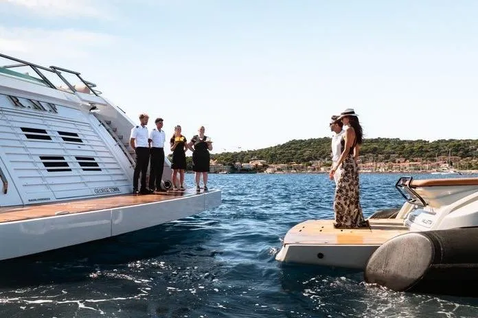 Rmf Yacht Photos Pics Luxury SACS Rebel 47 yacht with people enjoying a sunny day on the water, 2022 model.