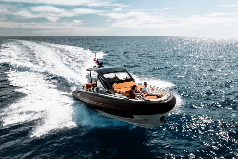 Rmf Yacht Photos Pics 2022 SACS Rebel 47 cruising on open sea under clear skies.