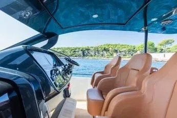 Rmf Yacht Photos Pics 2022 SACS Rebel 47 yacht interior with luxurious seating and scenic ocean view.