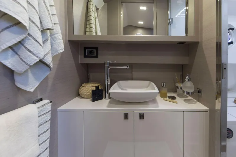 Rmf Yacht Photos Pics Modern bathroom interior on 2022 SACS Rebel 47 yacht, featuring sleek sink and elegant fixtures.