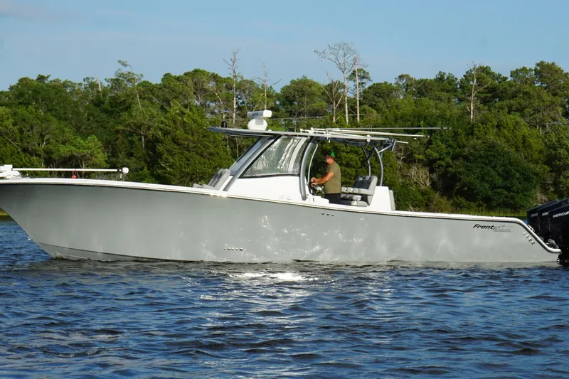  Yacht Photos Pics 2024 Front Runner 39 Center Console boat cruising on a scenic waterway.