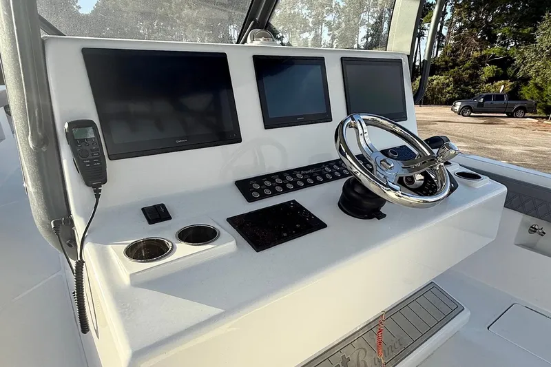  Yacht Photos Pics 2024 Front Runner 39 Center Console helm with advanced navigation displays and controls.