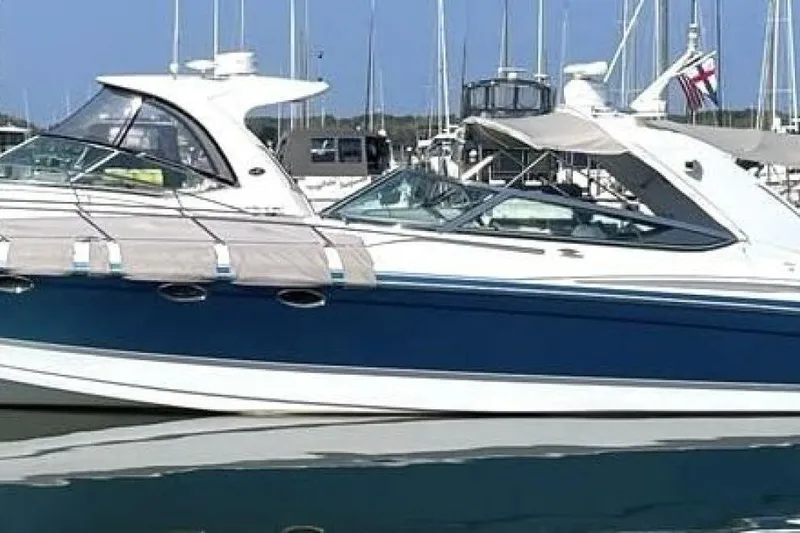  Yacht Photos Pics 2006 Formula 400 Super Sport Crossover yacht docked in marina, blue and white design.