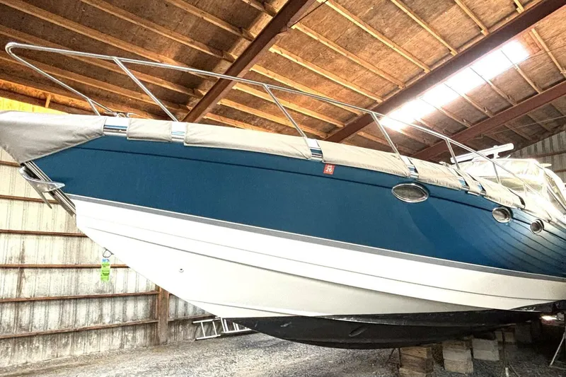  Yacht Photos Pics 2006 Formula 400 Super Sport Crossover boat stored indoors, blue hull, covered deck.