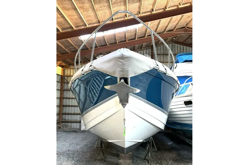  Yacht Photos Pics 2006 Formula 400 Super Sport Crossover boat stored in a wooden shed.