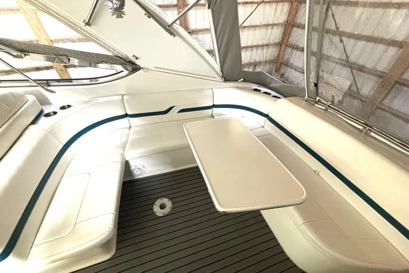  Yacht Photos Pics Interior of 2006 Formula 400 Super Sport Crossover boat with seating and table.