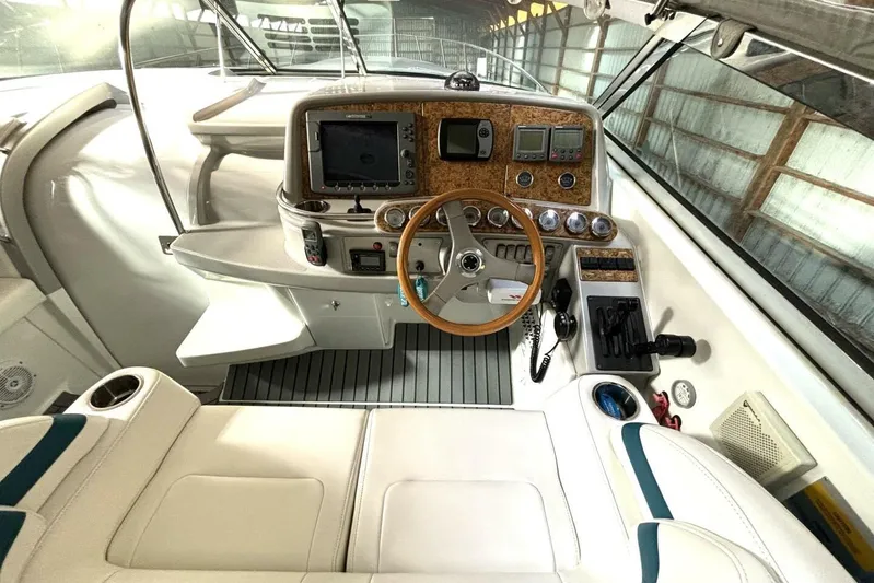  Yacht Photos Pics Cockpit of 2006 Formula 400 Super Sport Crossover with steering wheel and navigation controls.