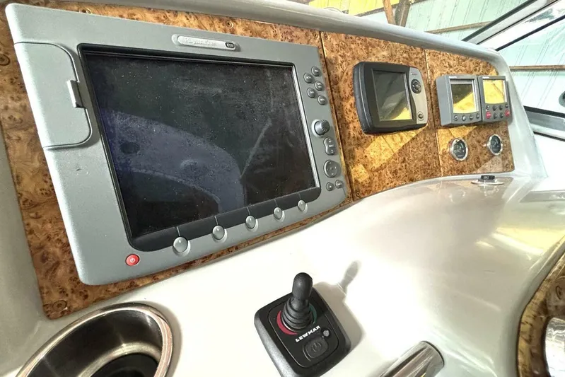  Yacht Photos Pics Control panel of a 2006 Formula 400 Super Sport Crossover boat with navigation screens.