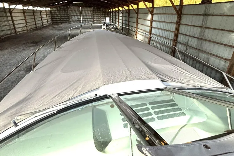  Yacht Photos Pics 2006 Formula 400 Super Sport Crossover boat covered in storage shed.