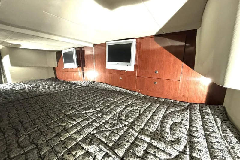  Yacht Photos Pics Interior cabin of 2006 Formula 400 Super Sport Crossover with wood paneling and TV.