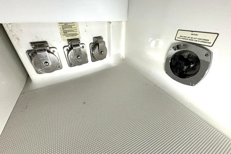  Yacht Photos Pics Control panel of a 2006 Formula 400 Super Sport Crossover boat with caution label.