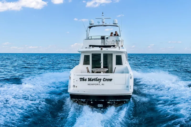 Motely Crew Yacht Photos Pics Navigator Rival 5700 yacht cruising on open sea, 2003 model, Newport, RI.