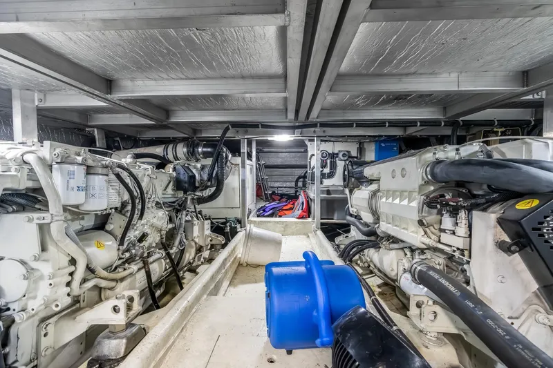 Motely Crew Yacht Photos Pics Engine room of 2003 Navigator Rival 5700 yacht with visible machinery and equipment.