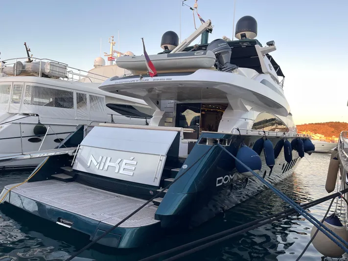 Nike Yacht Photos Pics Luxury yacht Dominator 860, 2007 model, docked at marina with sleek design.