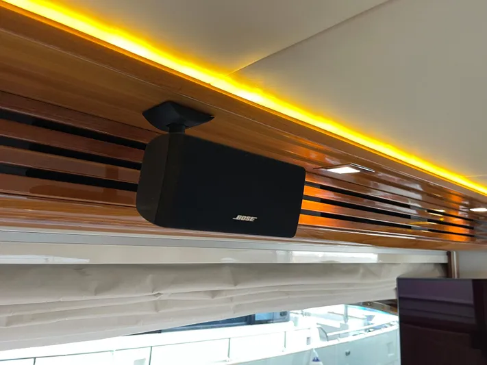 Nike Yacht Photos Pics Speaker mounted on a 2007 Dominator 860 yacht with elegant wood paneling and ambient lighting.