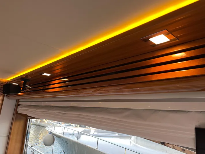 Nike Yacht Photos Pics Interior view of 2007 Dominator 860 yacht with elegant wooden ceiling and ambient lighting.