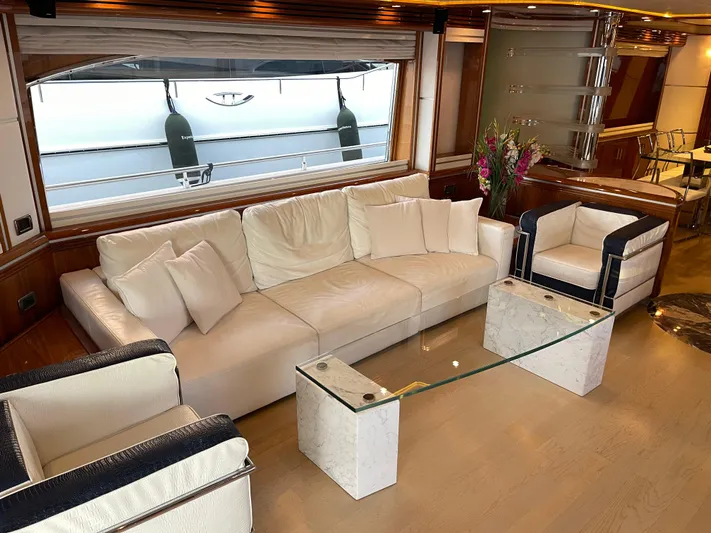 Nike Yacht Photos Pics Luxurious yacht interior with white seating, glass table, and elegant decor, Dominator 860, 2007 model.