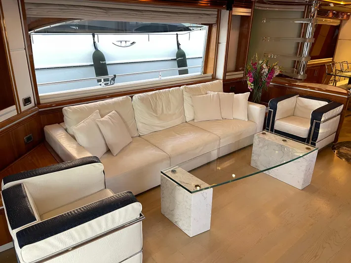Nike Yacht Photos Pics Luxurious yacht interior with white seating, glass table, and elegant decor, Dominator 860, 2007 model.