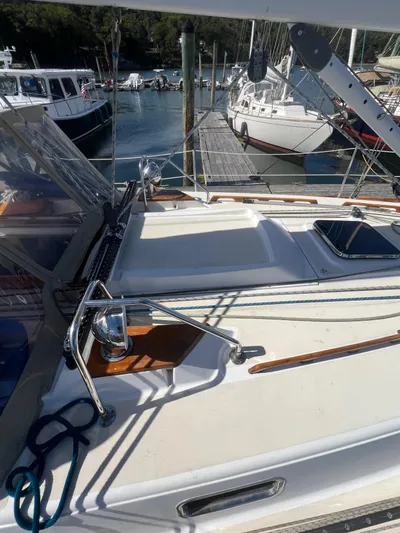  Yacht Photos Pics 2003 Tartan 4100 sailboat docked at marina, featuring deck and rigging.