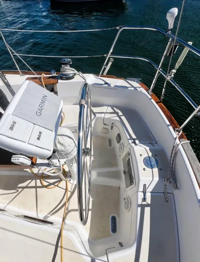  Yacht Photos Pics 2003 Tartan 4100 sailboat cockpit with Garmin navigation system, steering wheel, and control panel.