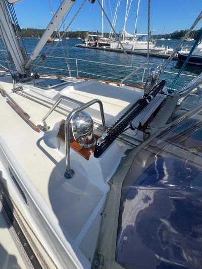 Yacht Photos Pics 2003 Tartan 4100 sailboat deck with marina view and clear blue sky.