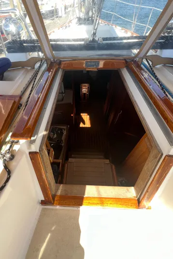  Yacht Photos Pics Interior view of 2003 Tartan 4100 sailboat, showing cabin entrance and wooden details.