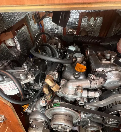  Yacht Photos Pics Engine compartment of a 2003 Tartan 4100 sailboat with visible components and wiring.