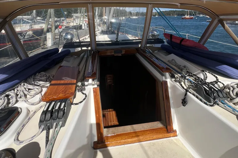  Yacht Photos Pics 2003 Tartan 4100 sailboat cockpit with ropes and open hatch, docked in marina.