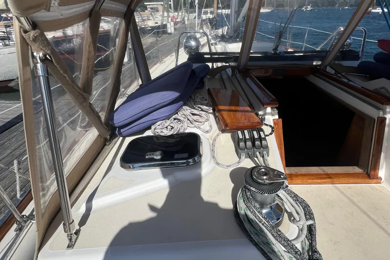  Yacht Photos Pics Tartan 4100 sailboat deck, 2003 model, featuring winch, ropes, and hatch in marina setting.