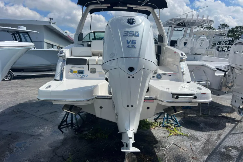 Yacht Photos Pics 2025 Chaparral 270 OSX boat with Yamaha 350 V6 engine, docked outdoors.