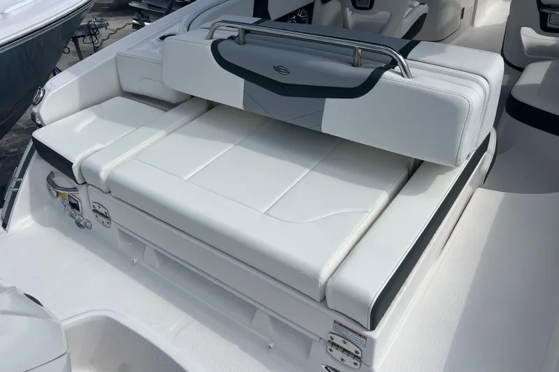  Yacht Photos Pics 2025 Chaparral 270 OSX boat interior with white cushioned seating.
