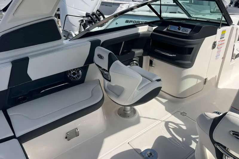  Yacht Photos Pics 2025 Chaparral 270 OSX boat interior with modern seating and dashboard design.