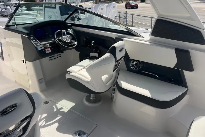  Yacht Photos Pics 2025 Chaparral 270 OSX boat interior with modern helm and seating.