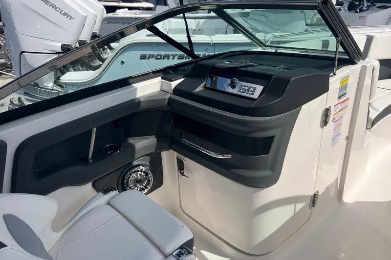  Yacht Photos Pics 2025 Chaparral 270 OSX boat interior with modern dashboard and seating.