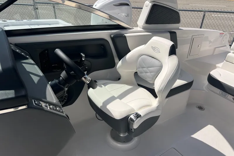  Yacht Photos Pics 2025 Chaparral 270 OSX boat interior with modern steering and luxurious seating.