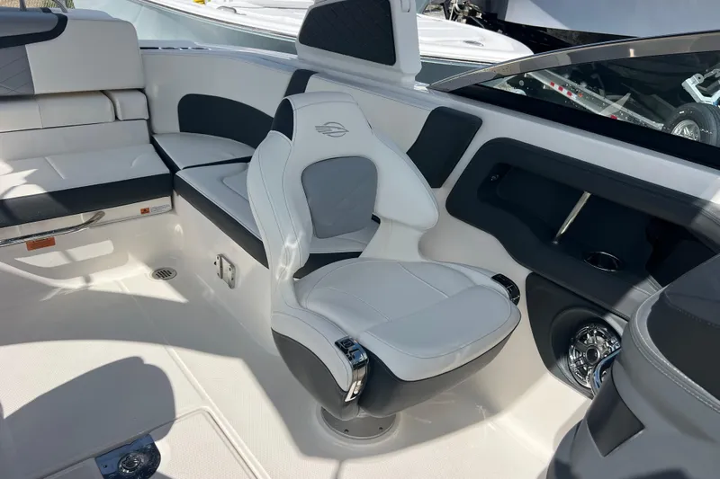  Yacht Photos Pics 2025 Chaparral 270 OSX boat interior with luxurious seating and modern design.