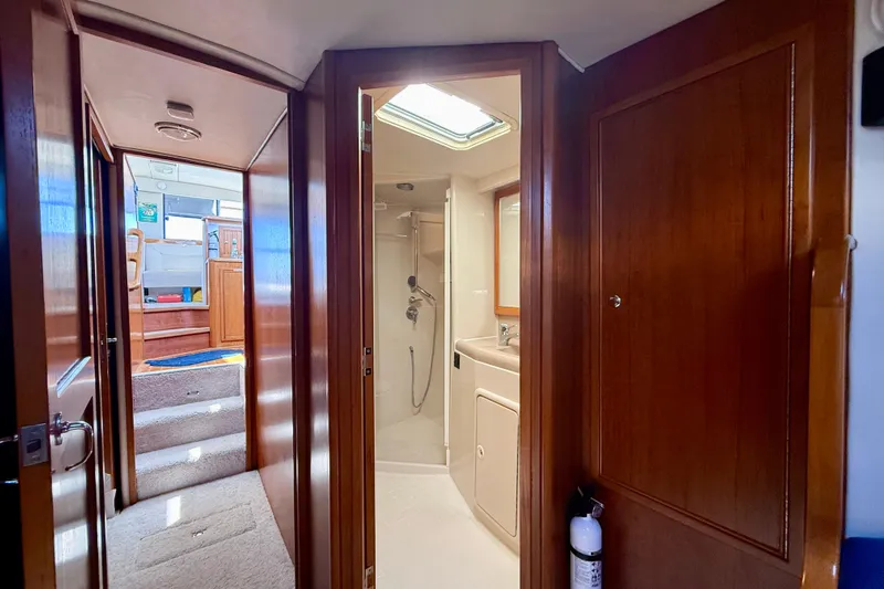 Seafood (reserved) Yacht Photos Pics Interior of 1998 Riviera 43 Open Flybridge yacht, featuring bathroom and hallway.