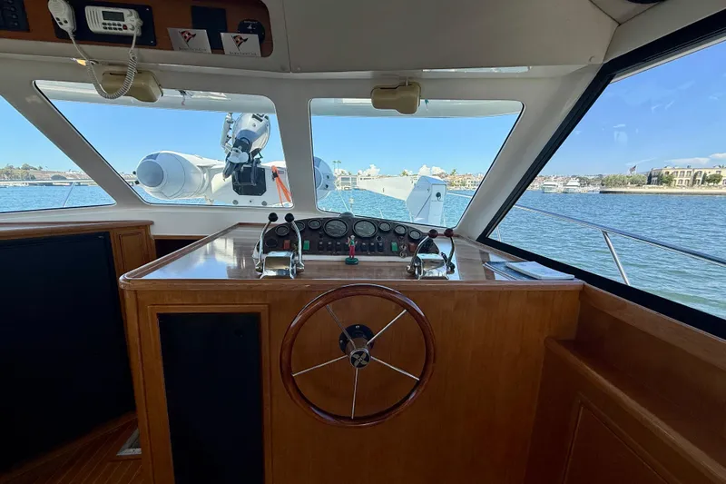 Seafood (reserved) Yacht Photos Pics 1998 Riviera 43 Open Flybridge helm with panoramic water view.