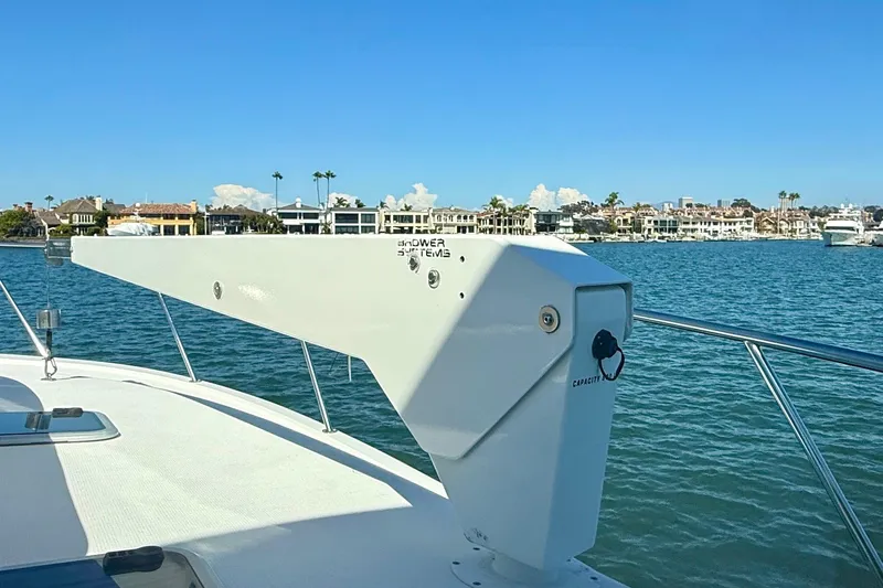 Seafood (reserved) Yacht Photos Pics 1998 Riviera 43 Open Flybridge yacht with scenic waterfront view.