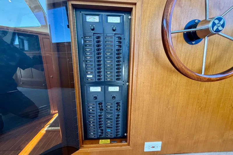 Seafood (reserved) Yacht Photos Pics Electrical panel and steering wheel on a 1998 Riviera 43 Open Flybridge yacht.