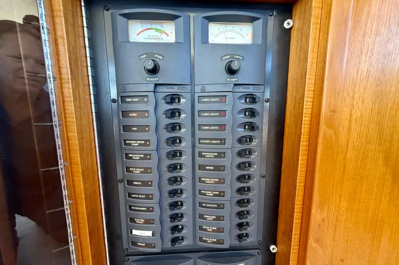 Seafood (reserved) Yacht Photos Pics Electrical panel of 1998 Riviera 43 Open Flybridge with labeled switches and gauges.