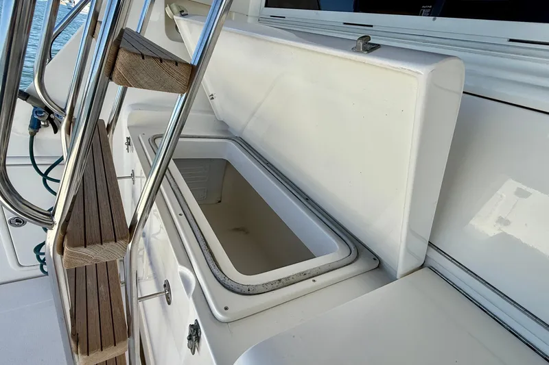 Seafood (reserved) Yacht Photos Pics Open storage compartment on 1998 Riviera 43 Open Flybridge boat deck.