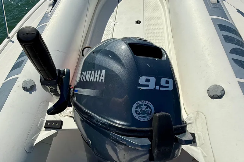 Seafood (reserved) Yacht Photos Pics Yamaha 9.9 outboard motor on a 1998 Riviera 43 Open Flybridge boat.