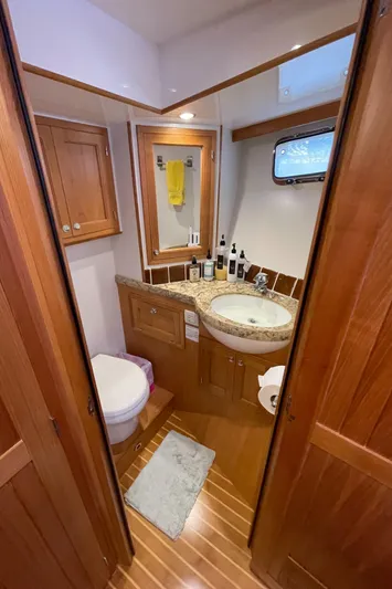 Sherlock Holmes Yacht Photos Pics Luxurious 2016 Kadey-Krogen 44E yacht bathroom with wooden cabinetry and modern fixtures.