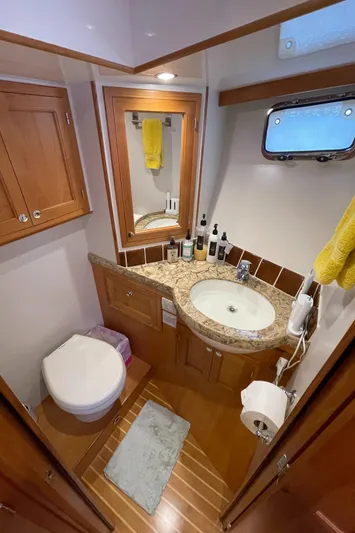Sherlock Holmes Yacht Photos Pics Luxurious bathroom in 2016 Kadey-Krogen 44E yacht with wood accents and granite countertop.