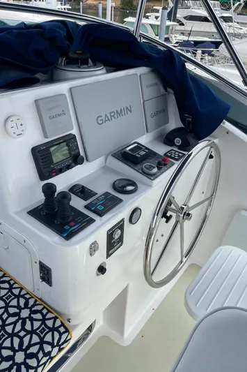 Sherlock Holmes Yacht Photos Pics Helm of 2016 Kadey-Krogen 44E with Garmin navigation equipment and steering wheel.
