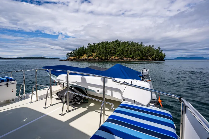 Sherlock Holmes Yacht Photos Pics Kadey-Krogen 44E yacht deck with island view, 2016 model, under partly cloudy sky.