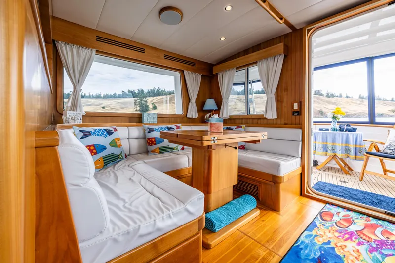 Sherlock Holmes Yacht Photos Pics Luxurious 2016 Kadey-Krogen 44E yacht interior with cozy seating and vibrant decor.