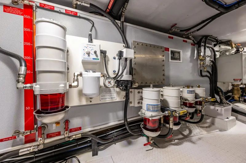 Sherlock Holmes Yacht Photos Pics Engine room of 2016 Kadey-Krogen 44E yacht with fuel filtration system and control panel.