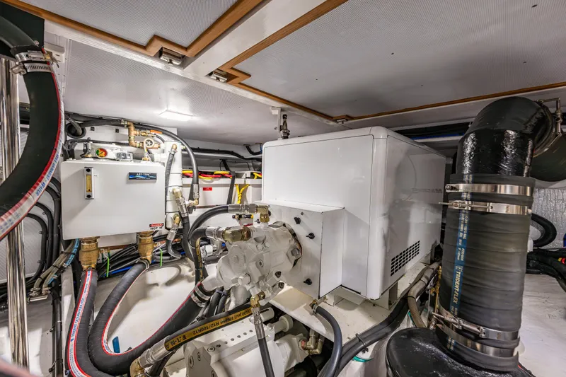 Sherlock Holmes Yacht Photos Pics Engine room of 2016 Kadey-Krogen 44E yacht, featuring mechanical systems and piping.